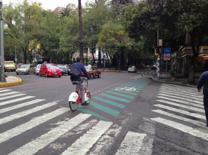 Ecobici user on green, separated bike lane