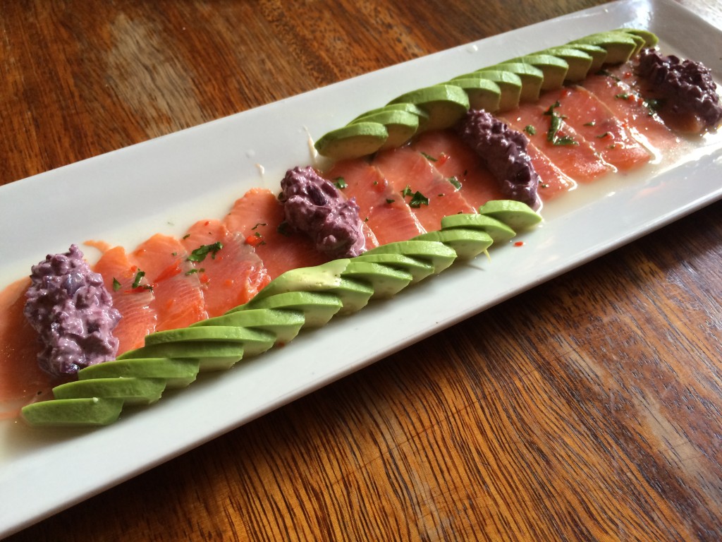 Salmon sashimi with olive spread and avocado